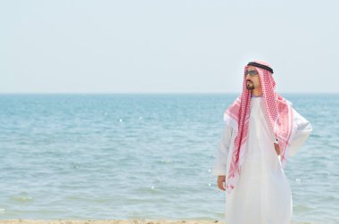 Arab on seaside in traditional clothing