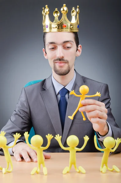 Boss with figures of his subordinates — Stock Photo, Image