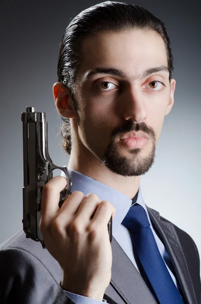 Homem de negócios com pistola de mão — Fotografia de Stock