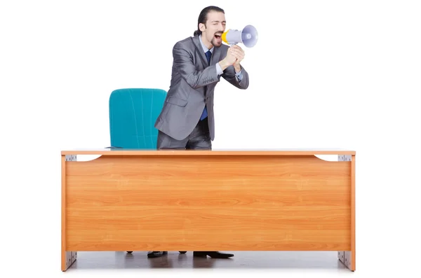 Бізнесмен з гучномовець за столом — стокове фото