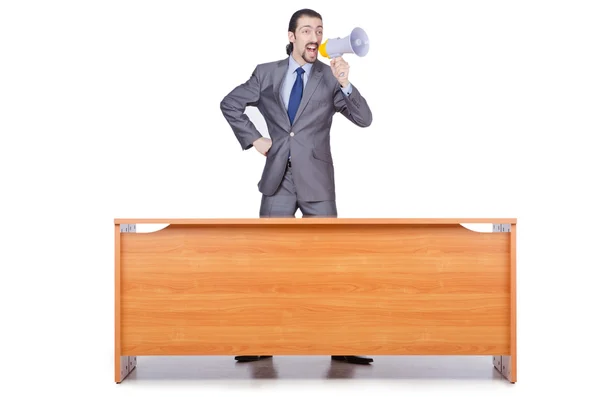 Affärsman med högtalare på skrivbordet — Stockfoto