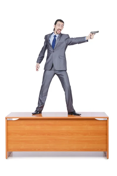 Empresário com arma sobre branco — Fotografia de Stock