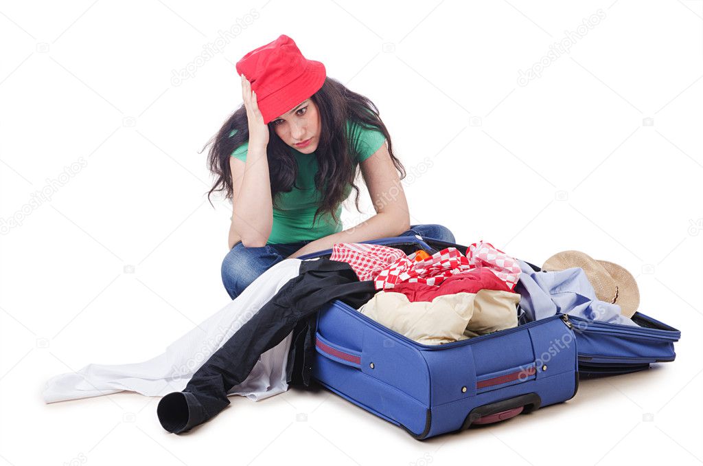 Girl packing for travel vacation