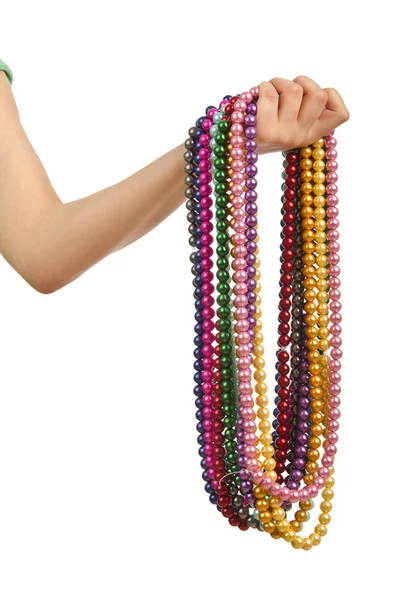 Collar de perlas en mano sobre blanco —  Fotos de Stock