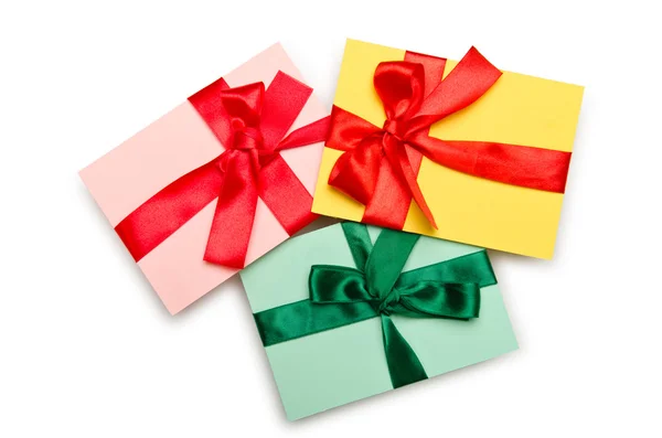 Envelope with colourful ribbon on white — Stock Photo, Image