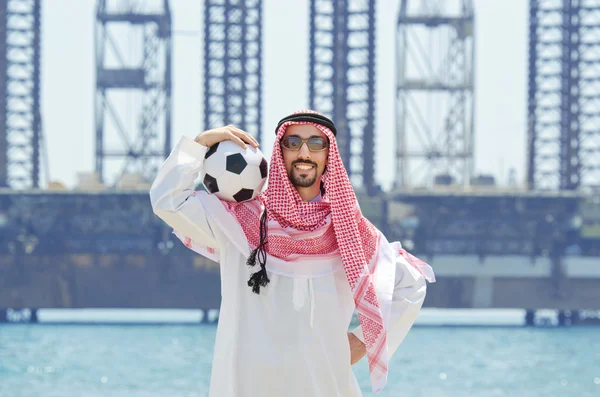 Arab with footbal at seaside — Stock Photo, Image