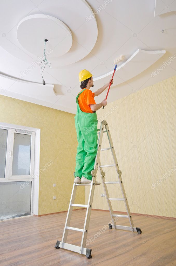 Painter worker during painting job Stock Photo by ©Elnur_ 11399905