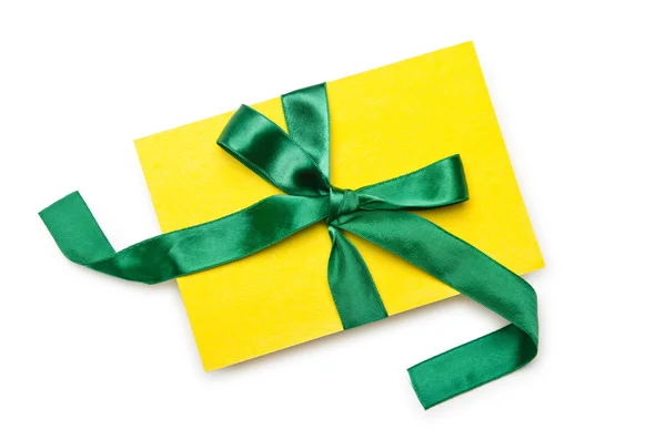 Envelope with colourful ribbon on white — Stock Photo, Image