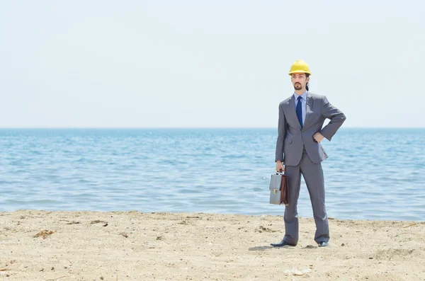 stock image Oil engineer on sea side beach