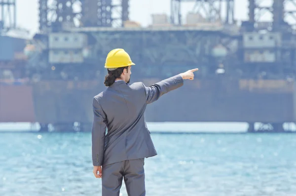 Oil engineer on sea side beach — Stock Photo, Image