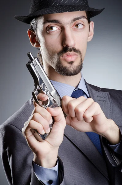Hombre de negocios con pistola de mano —  Fotos de Stock