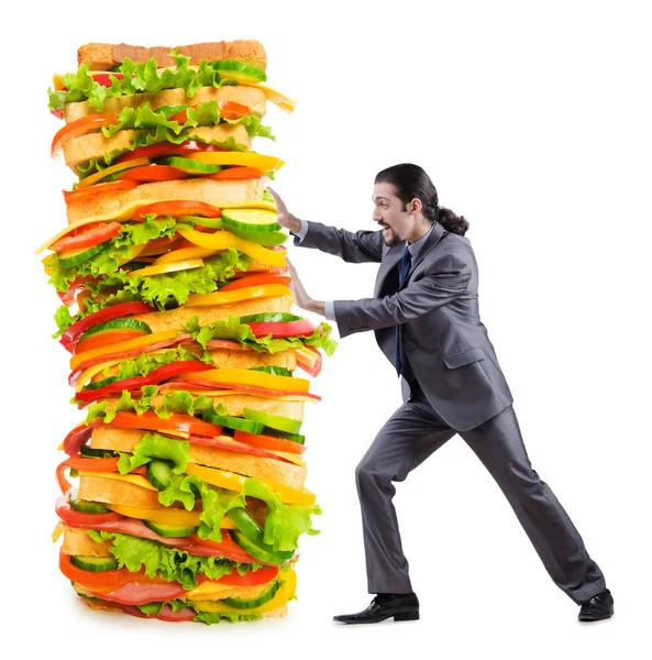 Homem e sanduíche gigante em branco — Fotografia de Stock