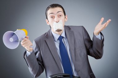 Businessman shouting via loudspeaker clipart