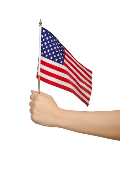 Ręka trzyma amerykańską flagę na biały — Zdjęcie stockowe