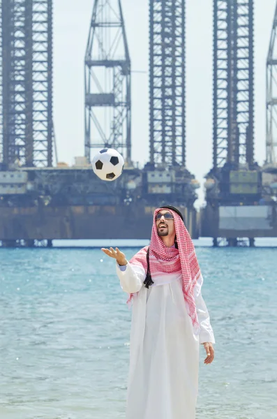 Arab with footbal at seaside — Stock Photo, Image