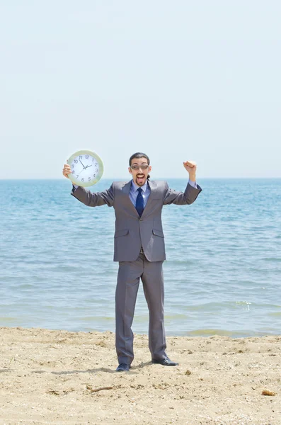 Man with clock on seaside — Stock Photo, Image