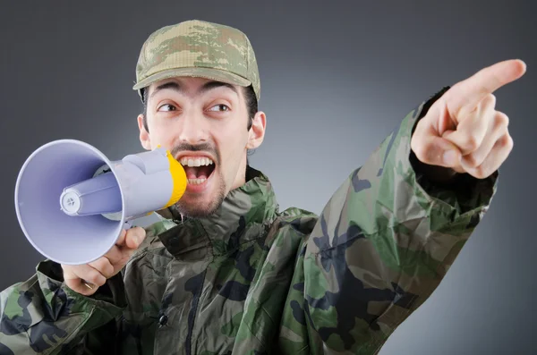 Soldier with loudspeaker shouting — Zdjęcie stockowe