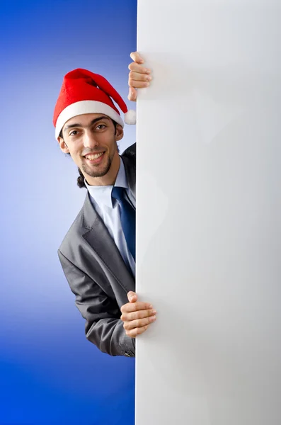 Uomo d'affari in cappello di Babbo Natale con messaggio vuoto — Foto Stock