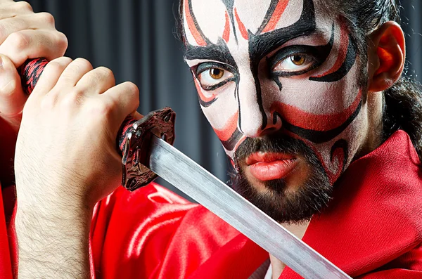 Man with face mask and sword — Stock Photo, Image