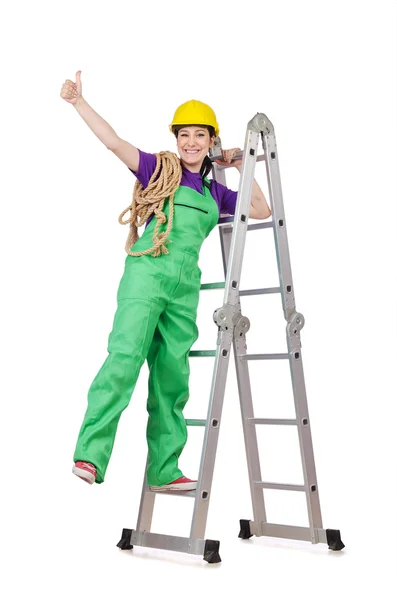 Woman worker standing on ladder — Stock Photo, Image