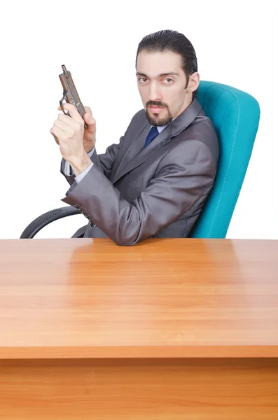 Бизнесмен с пистолетом на белом — стоковое фото