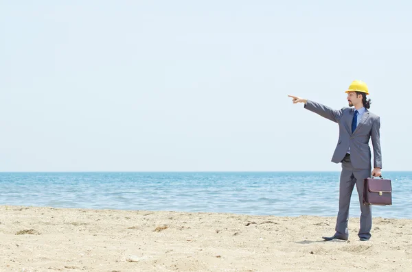 stock image Oil engineer on sea side beach