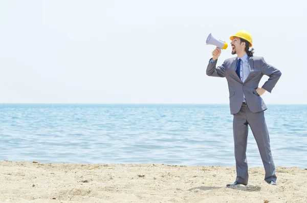 stock image Man wearing helmet speaks with megaphone