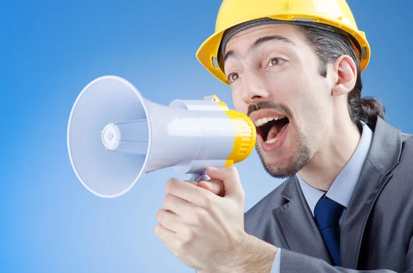 Trabajador de la construcción gritando a través de un altavoz —  Fotos de Stock