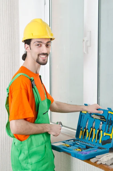 Repairman in coveralls in industrial concept — Stock Photo, Image