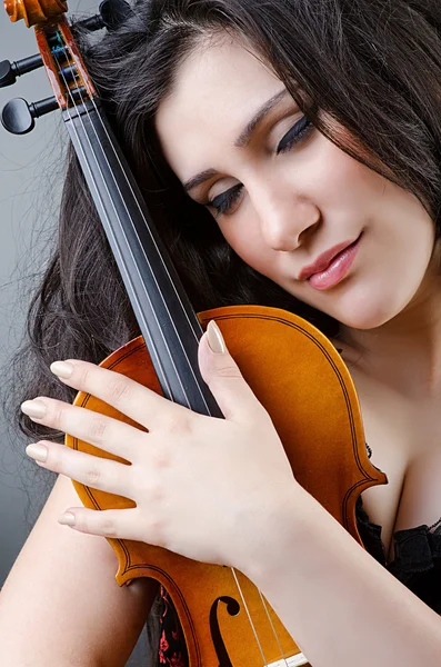 Female violin player against background — Stock Photo, Image
