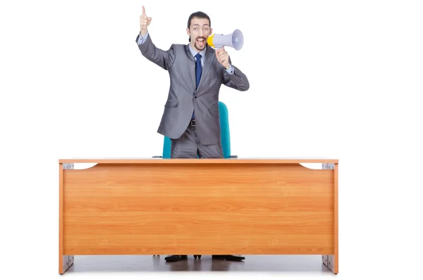 Businessman with loudspeaker at the desk — Stock Photo, Image