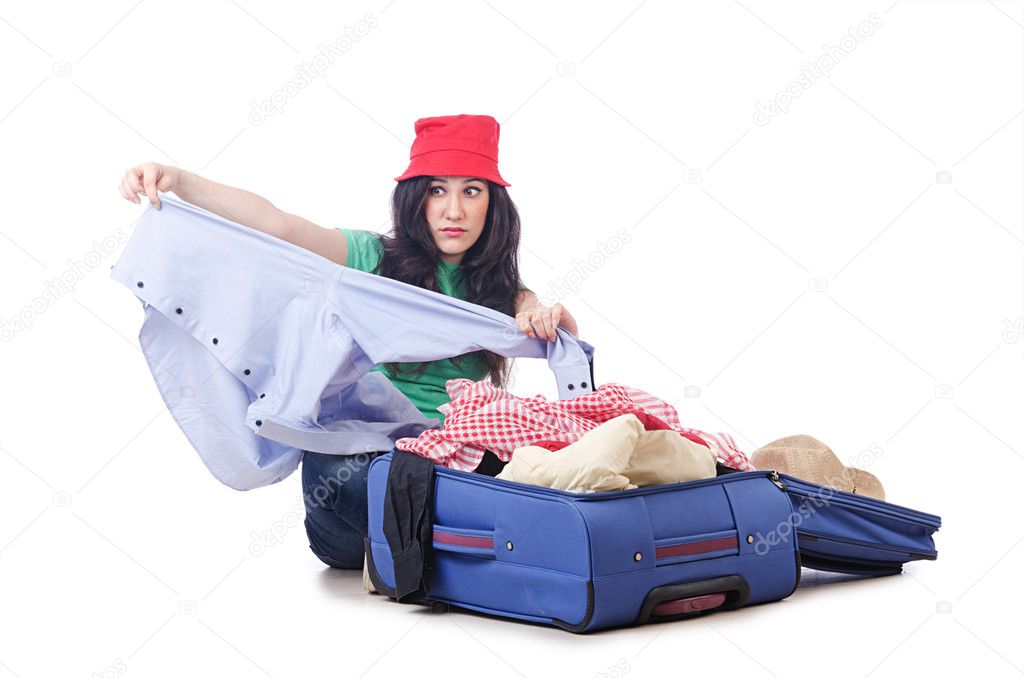 Girl packing for travel vacation