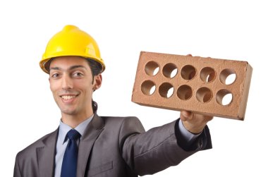 Businessman with bricks on white