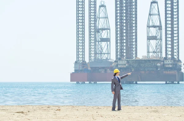 stock image Oil engineer on sea side beach