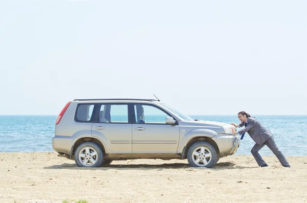 Man with car on seaside — Stock Photo, Image