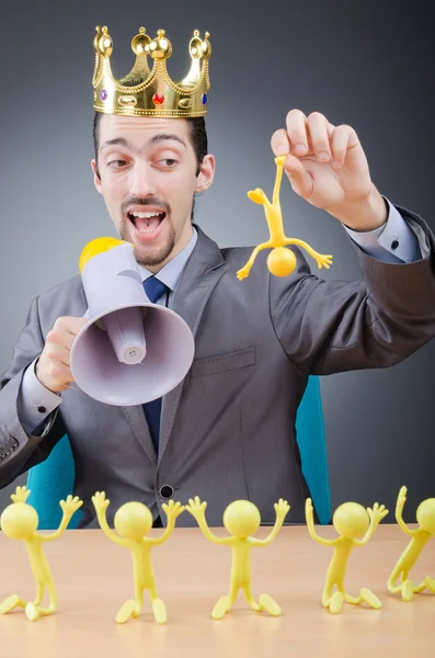 Boss with figures of his subordinates — Stock Photo, Image