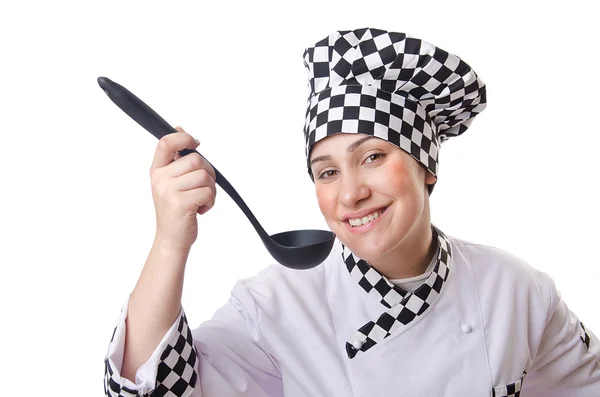 Žena kuchařka s naběračkou na bílém — Stock fotografie