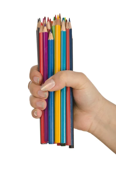 Hand met kleur potloden op wit — Stockfoto