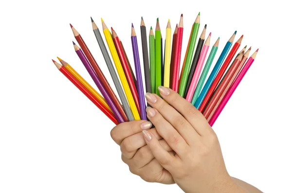 Hand met kleur potloden op wit — Stockfoto