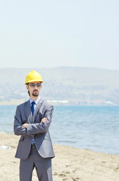 stock image Oil engineer on sea side beach