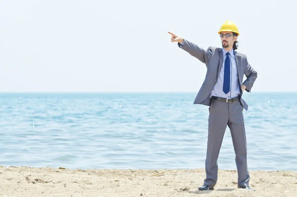 stock image Oil engineer on sea side beach