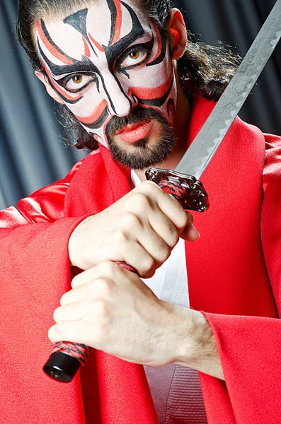 Man with face mask and sword — Stock Photo, Image