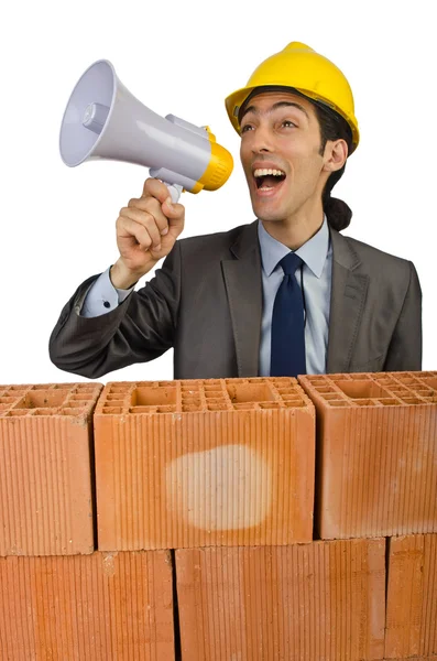 Businessman with bricks on white — Stock Photo, Image