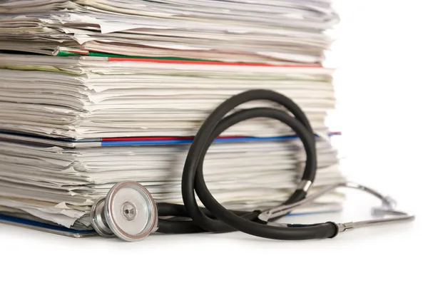 Stack of papers with stethoscope — Stock Photo, Image