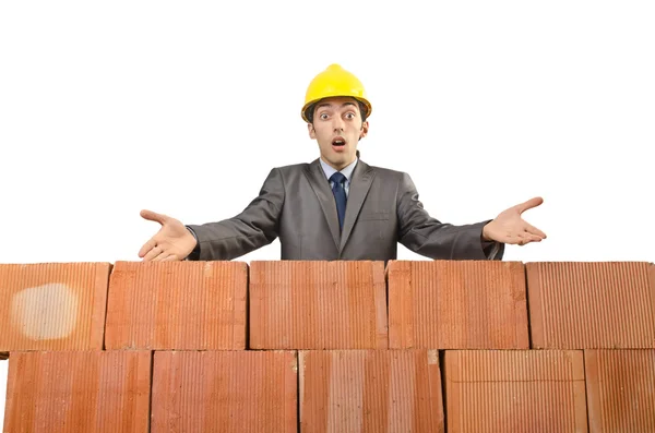 Businessman with bricks on white Stock Image