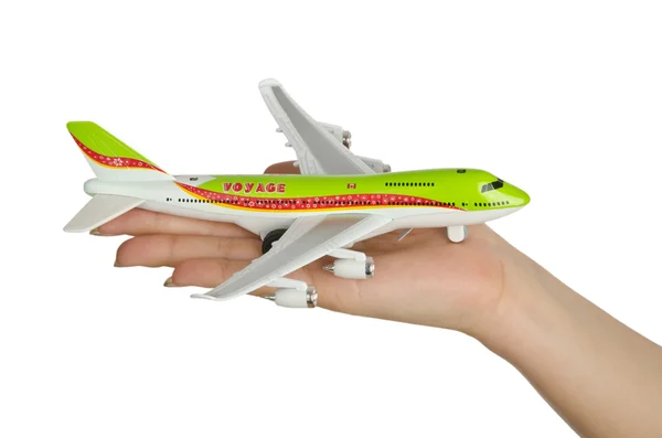 Avião de brinquedo mão segurando isolado no branco — Fotografia de Stock
