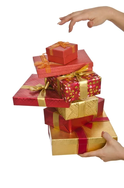 Hand holding stack van giftboxes — Stockfoto