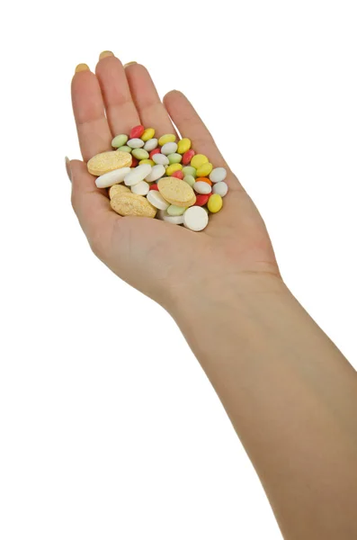 Handen met pillen op wit — Stockfoto