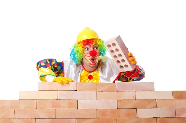 stock image Bad construction concept with clown laying bricks