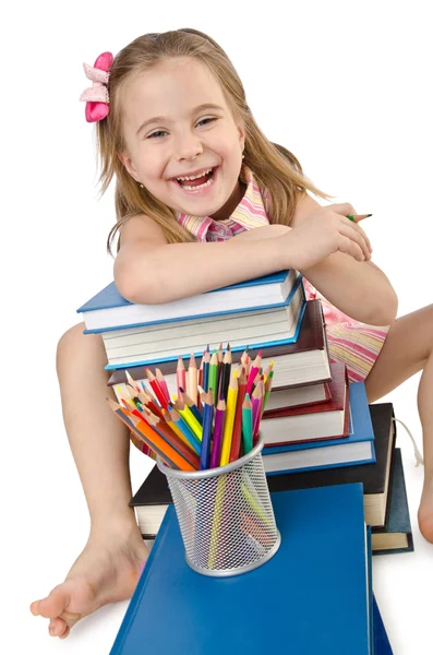 Kleines Mädchen mit Büchern auf weiß — Stockfoto